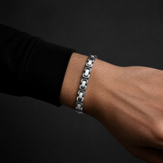 Obelisk Link bracelet worn with a black sleeve
