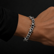 Razorwire Chain bracelet worn with a black sleeve